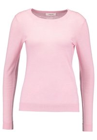 Pull long à manches longues de couleur rose clair, fabriqué en maille douce. Il possède un col rond et des poignets et un ourlet côtelés pour un look ajusté.