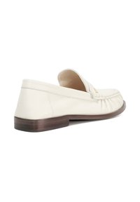 Cream leather loafer with a rounded toe, stitched detailing, and a low brown sole. Features a subtle gathered design on the upper.