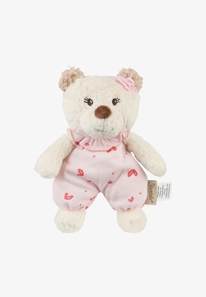Small cream-colored teddy bear with curly ears, wearing pink heart-patterned romper and a pink fabric flower on its head.
