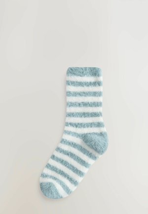 Fuzzy light blue and white striped sock with a soft texture, rounded toe, and ribbed cuff, designed for comfort and warmth.