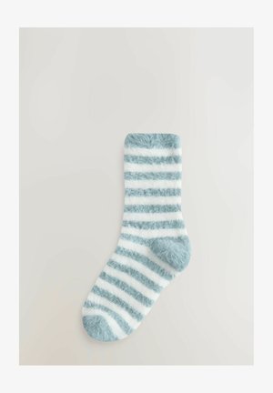 Fuzzy light blue and white striped sock with a soft texture, rounded toe, and ribbed cuff, designed for comfort and warmth.