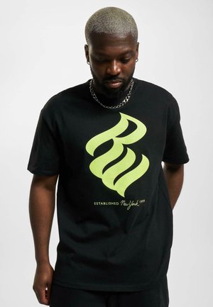 Black cotton t-shirt featuring a large yellow-green graphic design and text "ESTABLISHED New York 1999" on the front. Short sleeves.