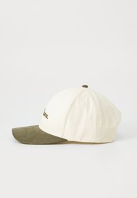 Baseball cap with a white cotton body and an olive green suede brim. Features embroidered text on the front, with visible stitching.