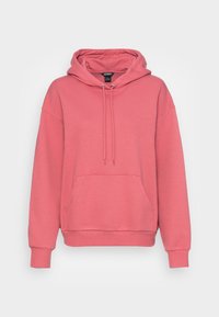 Růžová mikina s kapucí, klokaní kapsou, žebrovanými manžetami a lemem. Vyrobena z měkké látky s nastavitelnými šňůrkami na kapuci.