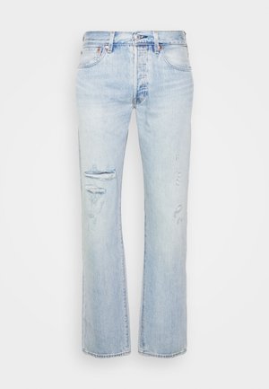 Light blue denim jeans with a straight fit, featuring distressed patches and frayed hems. Subtle fading and classic hardware accents.