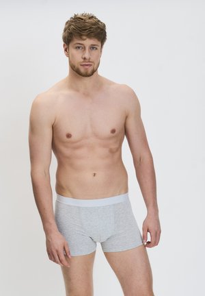 Grau Baumwoll-Boxershorts mit einem weißen elastischen Bund. Der Stoff wirkt weich mit einer glatten Textur und einem engen Sitz.