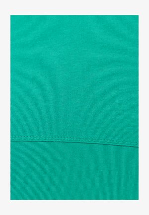 Un tissu turquoise vibrant avec une surface lisse et texturée, présentant un motif fin côtelé et des coutures renforcées le long de l'ourlet.