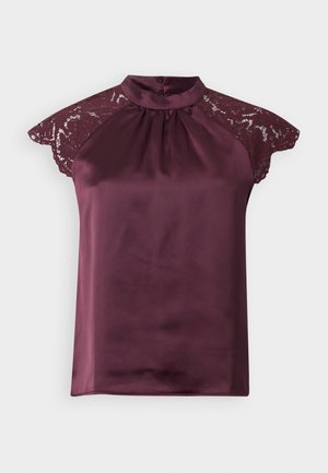 Satin burgundy top with lace cap sleeves, high neckline, and pleated design. Fastens at the back with two buttons. Smooth, glossy texture.