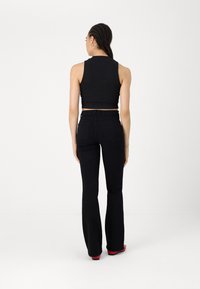 ONLY ONLRAIN FLARED  - Široké džíny - washed black