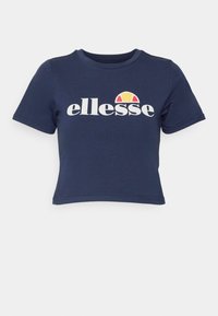 Navy blue cropped t-shirt made of cotton with a round neckline. Features "ellesse" logo in white and a colorful graphic above.