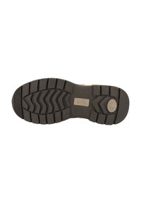 Suela de zapato de goma negra con un patrón de banda de rodadura en zigzag para tracción, con una placa de logo rectangular grabada en el centro.