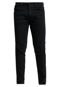 Jeans in denim nero con vestibilità slim. Presentano un design standard a cinque tasche, passanti per cintura e una chiusura con bottone metallico in vita.