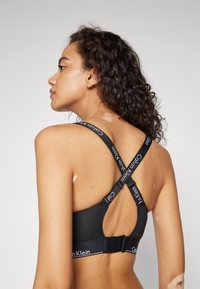 Calvin Klein Underwear LIGHTLY LINED ICON - Sujetador sin tirantes/multiescote - black