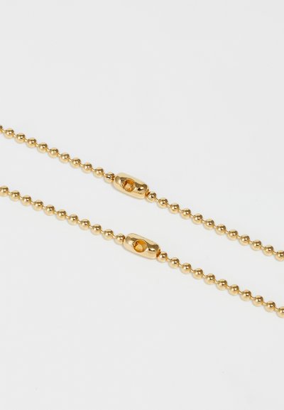 Collana in oro con una catena di perline rotonde e chiusure ovali lisce. La superficie è lucida, con un dettaglio testurizzato sulle chiusure.