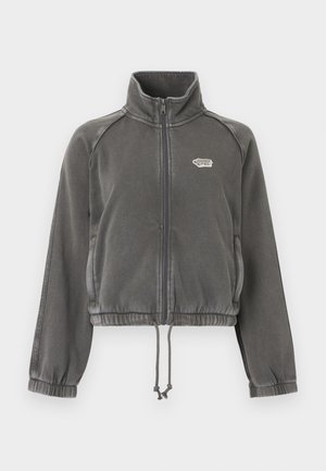 Tumehall fliisist lukuga jakk kõrge kraega, elastsete mansettide, nööriga allääre ja vasakul rinnal väikese valge logoga.