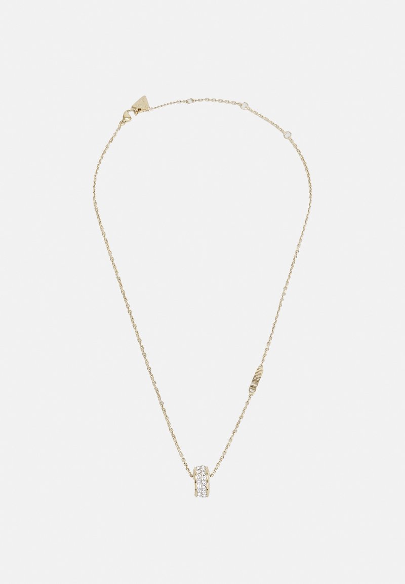 Collier délicat en chaîne d'or avec un petit pendentif rond incrusté de pierres claires et étincelantes.