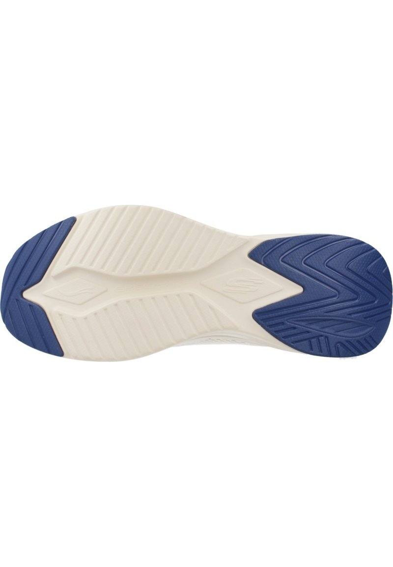Suela de zapato con un esquema de colores en beige y azul marino; patrón texturizado con surcos y crestas para un mejor agarre; diseño moldeado con bordes curvados.