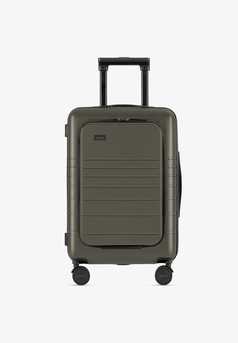 Hartschalenkoffer in Olivgrün, mit einer strukturierten Frontblende mit horizontalen Linien, einem teleskopierbaren Griff und vier sanft rollenden Rädern.