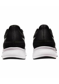 Black athletic shoes with a mesh upper, round heel, and a white textured midsole. Features a smooth design with subtle logo accents.
