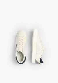 Cream leather sneakers with navy accents. Features include perforated design, flat laces, and a textured rubber sole. Brand name visible inside.