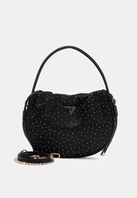 Schwarze Handtasche aus Stoff mit weißen Punkten, runder Form, Obergriff und abnehmbarem Riemen. Verfügt über ein markiertes dreieckiges Logo.