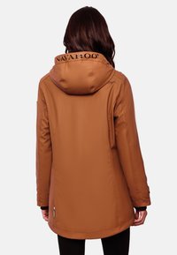 Brown waterproof jacket with a hood, featuring a logo on the collar and a sleek, streamlined design. Smooth texture and long sleeves.