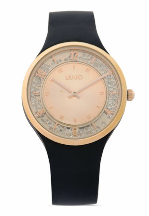 Orologio da polso rotondo con cinturino nero, lunetta color oro, quadrante rosa, dettagli in cristallo intorno al quadrante e il nome del marchio "LIU·JO" al centro.