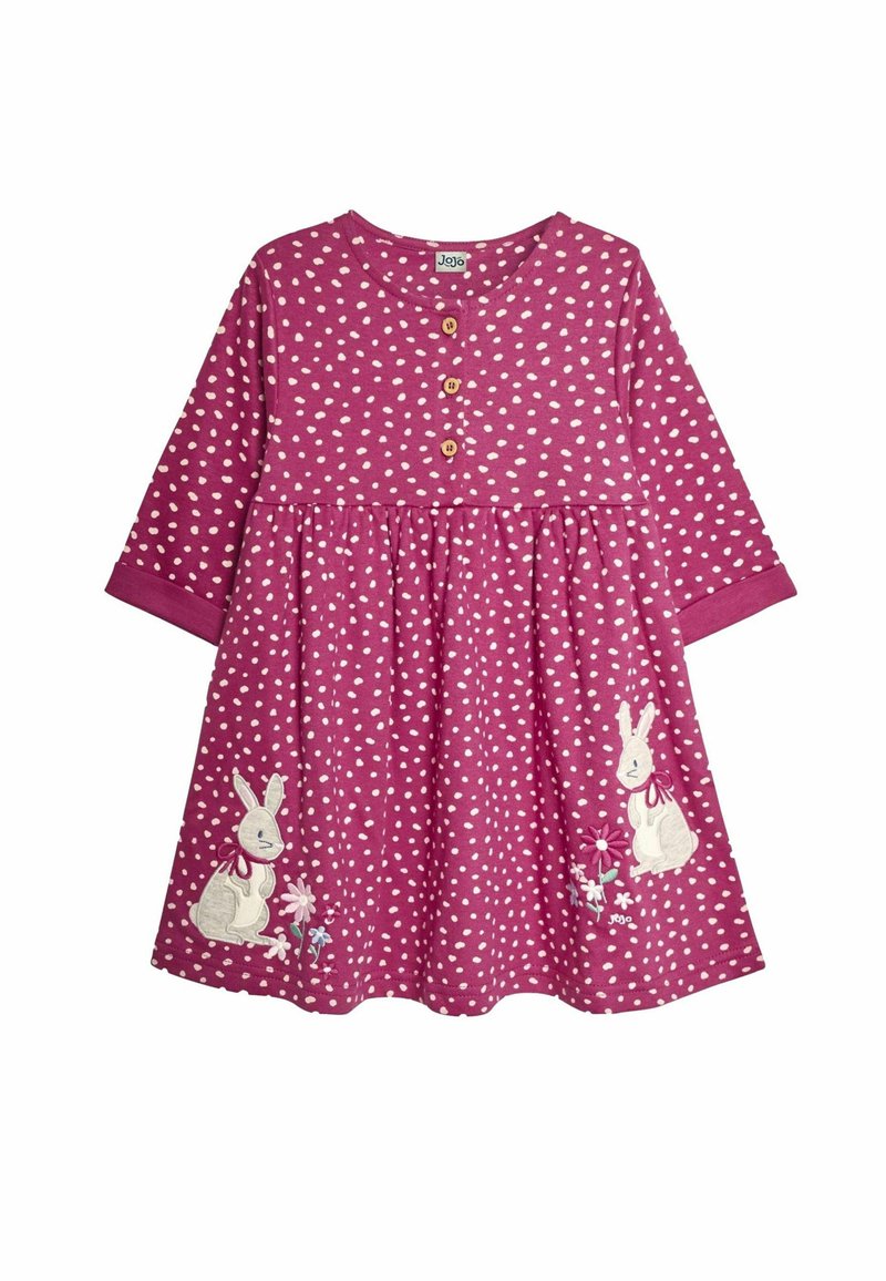 Robe rose à pois blancs, manches longues, col à trois boutons, lapins brodés et fleurs au bas. Matière en coton doux.