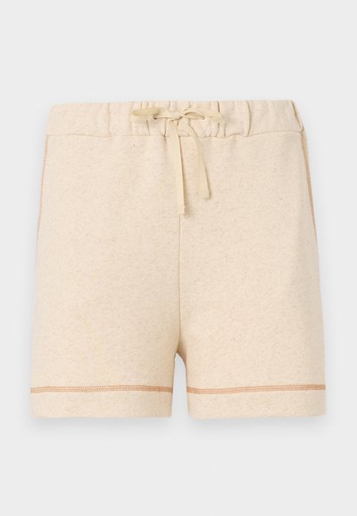 Beige bomullsshorts med elastisk liv og snøring. Har kontrasterende sømmer langs kanten og sidene.