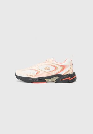 Lacoste sneaker featuring a mesh upper in light pink with white accents, black rubber sole, and a distinctive logo on the side.