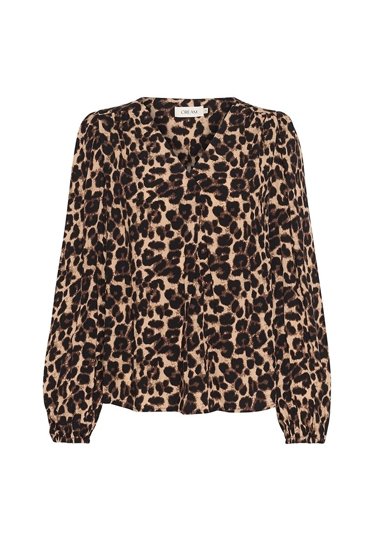 Blouse à imprimé léopard en beige et noir, avec un col en V, des manches longues bouffantes et une coupe décontractée. Tissu doux et texturé.