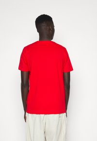 Puma ESS COL LOGO - Marškinėliai su spaudiniu - high risk red