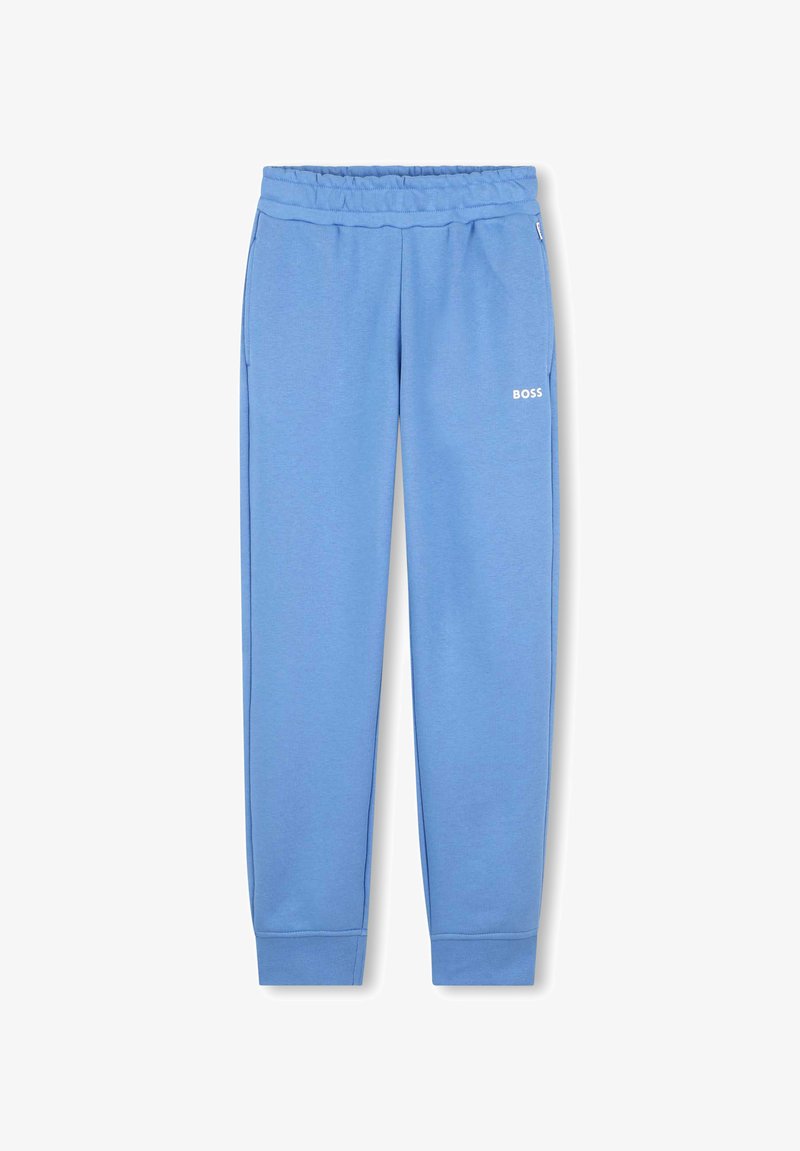 Pantalons de survêtement bleus en tissu doux, dotés d'une taille élastique, de poches latérales et d'un petit logo blanc sur la cuisse gauche.