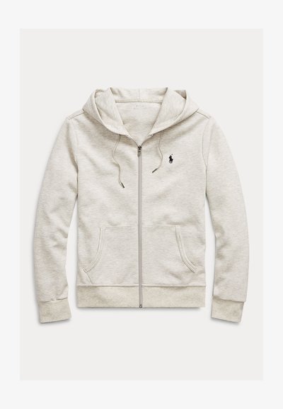 Ljusgrå zip-up-hoodie i mjukt tyg med känguruficka, dragsko i huvan och liten svart logotyp på vänster bröst.