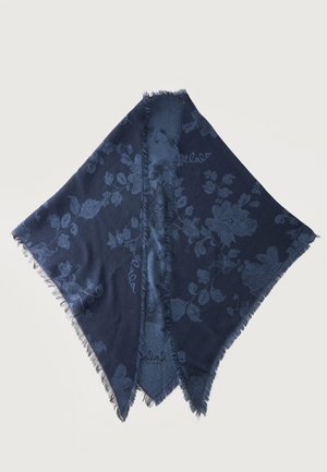 Écharpe bleu foncé avec un motif floral et des bords frangés, pliée avec une ouverture centrale, présentée sur un fond blanc.