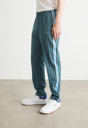 UNISEX - Pantalones deportivos - green/argentine blue