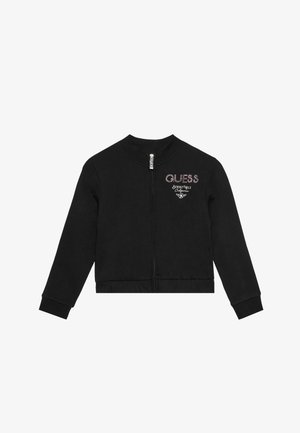 Veste noire zippée en coton. Comprend des poignets côtelés, un col rond, et un logo "GUESS" en strass sur la poitrine.