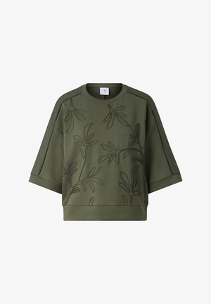 Krátká mikina olivově zelené barvy s krátkými rukávy, vyšívaným vzorem listové révy a otevřeným prošíváním podél ramen a rukávů.