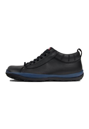 Black leather sneaker featuring a rounded toe, lace-up design, blue rubber sole, and textured accents on the heel.