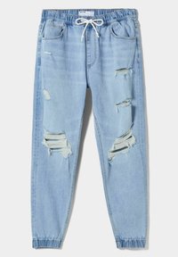 Ljust blå rivna denim-joggare med elastisk midja, vit dragsko, framfickor och elastiska muddar.