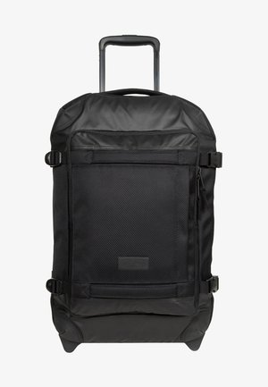 Bolsa de lona negra con textura, asa resistente y múltiples compartimentos con cremallera para un almacenamiento organizado.