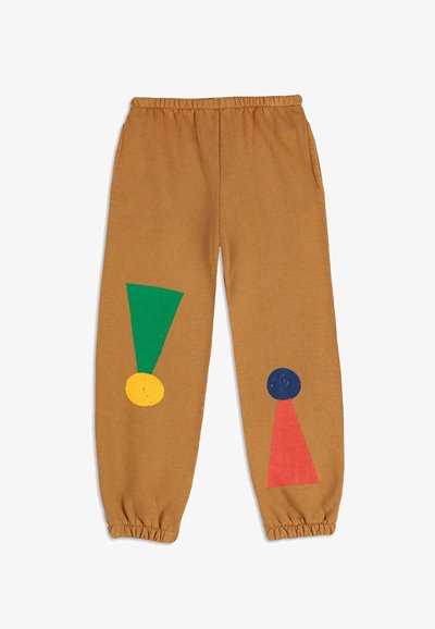 Pantaloni della tuta marroni con vita elasticizzata, caratterizzati da forme geometriche colorate: triangolo verde, cerchio giallo, cerchio blu e triangolo rosso.