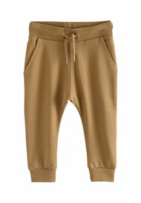 Bruna bomullsjoggers med ribbad midja, snörning och sidfickor; avsmalnande ben med ribbade muddar. Slät textur och avslappnad design.