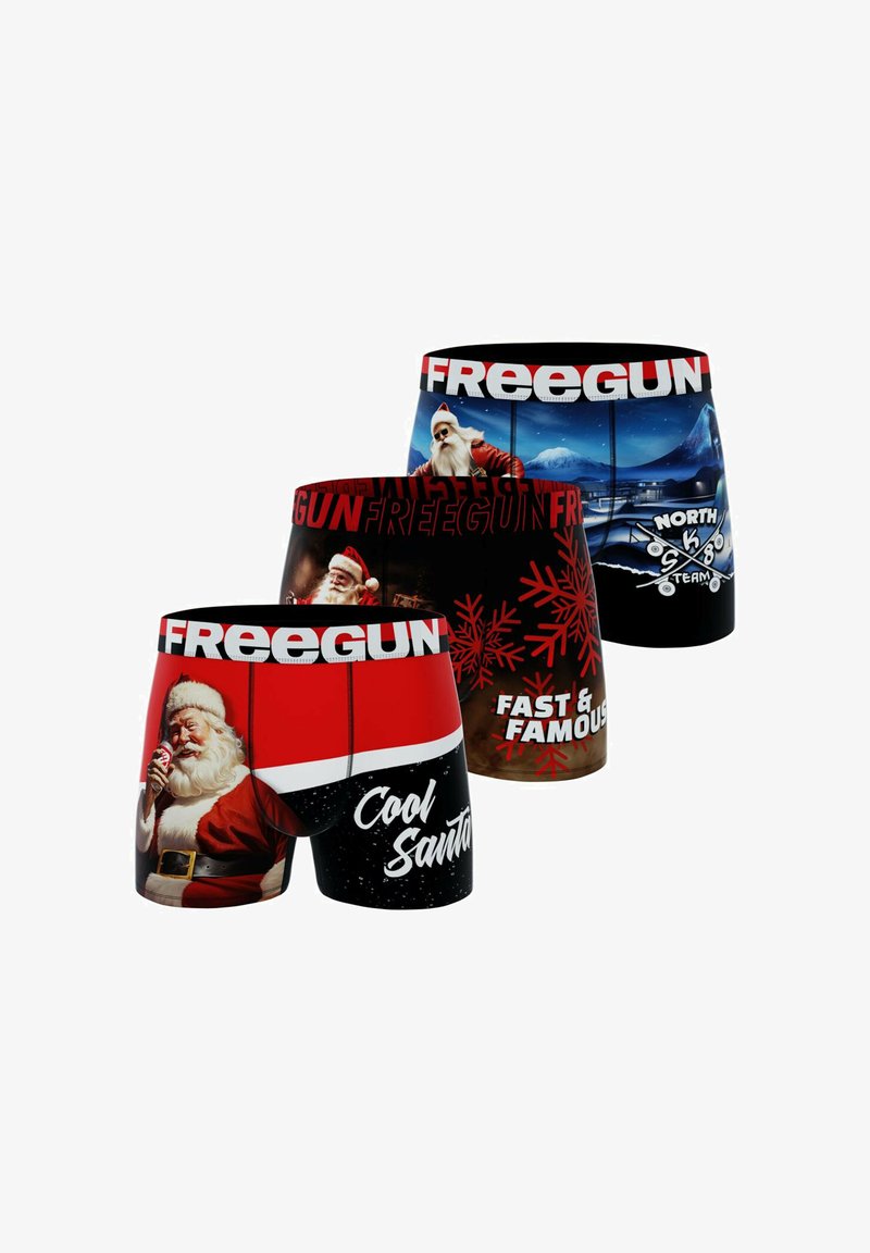 Boxers avec des motifs colorés de Père Noël, dans des couleurs rouge et noire, avec des motifs dynamiques, du texte blanc et une taille élastique avec "FREEGUN."