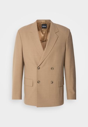 Beige doppelt geknöpfter Blazer aus strukturiertem Stoff, mit zwei vorderen Taschen und Messingknöpfen. Innenfutter aus hellen Satin.