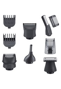 Sorte plejevedhæng arrangeret i et fladt layout, der viser forskellige former og størrelser, herunder kamguider og trimmerhoveder med strukturerede greb.