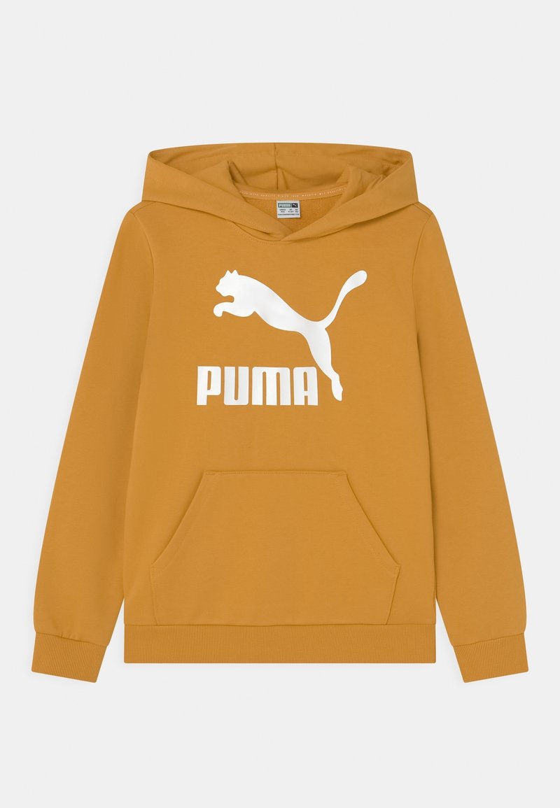 Felpa giallo senape realizzata in morbido tessuto. Presenta una tasca a marsupio frontale, polsini a coste e un grande logo Puma bianco sul petto.