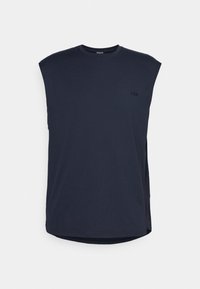 Débardeur bleu marine sans manches avec col rond et petit logo noir sur le côté gauche de la poitrine, présenté sur un fond uni.