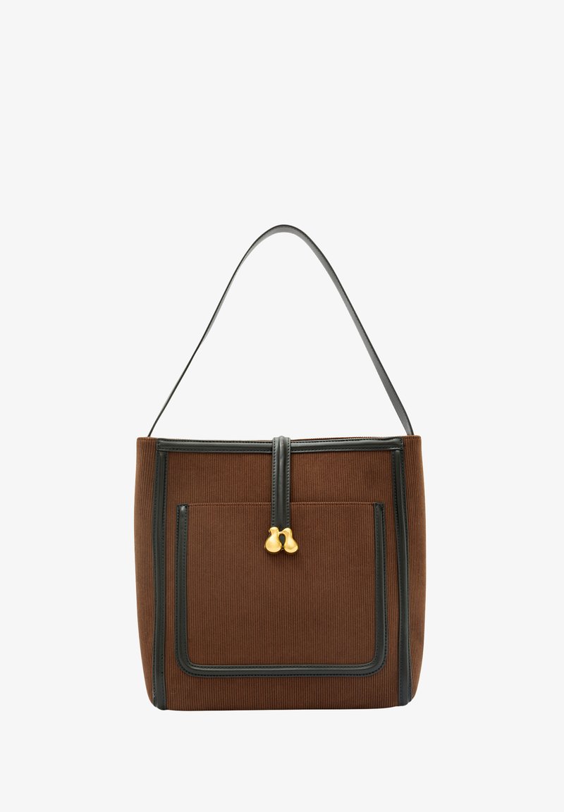 Brązowa torba typu tote z korduroju o wyraźnym kształcie, z czarnymi skórzanymi detalami i zapięciem na zamek, zdobiona złotymi akcentami.