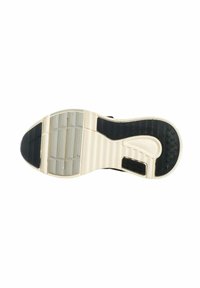 Suola di una sneaker che presenta una combinazione di gomma nera e bianca con motivi testurizzati, scanalature e un logo sul lato.